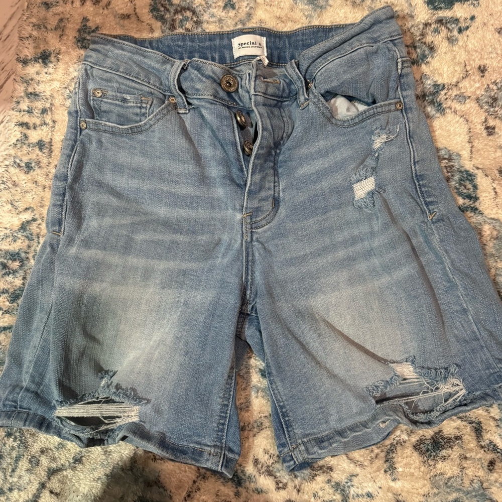 Judy blue shorts. Longer inseam but can be rolled so cute! Distressing